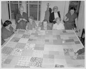 Women sewing quilt 